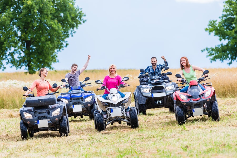 A family all on ATVs.